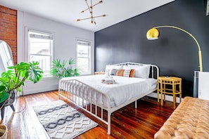 Our spacious bedroom is perfect for families, with a king-size bed and additional sleeping arrangements. The bright, cheerful decor and comfortable furnishings make it a home-away-from-home