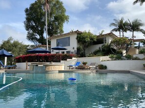 Disappearing edge pool with spa. One must take stairs from the main to the pool.