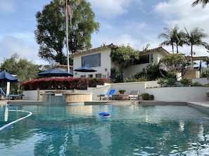 Disappearing edge pool with spa. One must take stairs from the main to the pool.