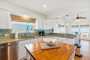 Kitchen opens to dining and family room as well as ocean view.