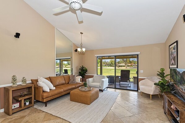 Spacious living room with plenty of seating and smart T.V. 