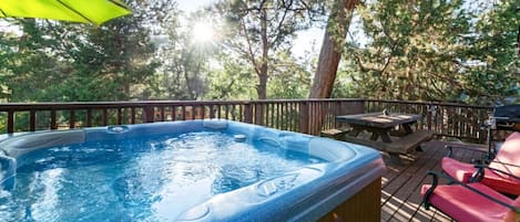 Indulge in luxury as you soak the hot tub amidst nature's beauty. Your tranquil escape awaits.