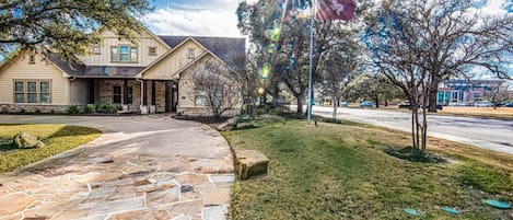 Front view of house - street pictured is George Bush Drive