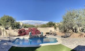 Relax and enjoy unplugged family time in the large private backyard that features a Pebble Fina finished pool with water feature and color changing LED light, & Mountain View’s.