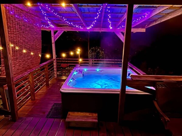 Soothing Jacuzzi is enhanced by the sounds of Greenbriar Creek flowing in the background.