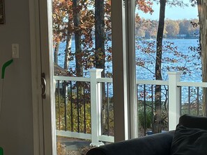 View of the lake from the living room and onto the deck