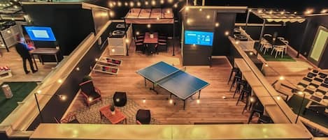 Enjoy some ping pong, TV, and cornhole on Elvis' rooftop!