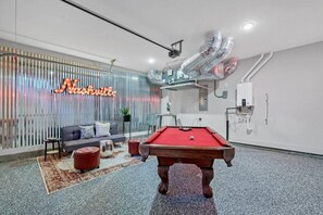 Enjoy some TV or a game of pool in the converted garage area