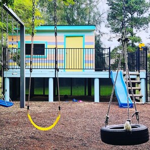 Kids can enjoy our colourful cubby , sand pit and swings and large Trampoline.