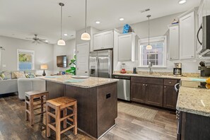 Kitchen with Bar Stool Seating on First Level