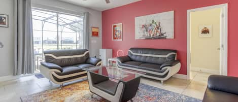 The living room features modern furniture complimenting all the wonderful artwork.