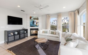 Cozy Living Area Featuring a Fireplace and TV