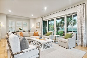 Living Room with large windows out to the porch