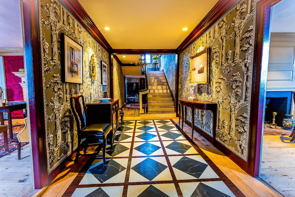 A long hallway and stairs in a historic Portsmouth New Hampshire vacation rental