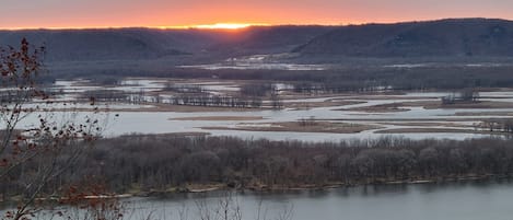 Sunset overlooking the river and bluffs towards Iowa