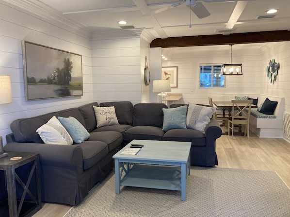The cool coastal colors of the living room welcome you to your island getaway! 