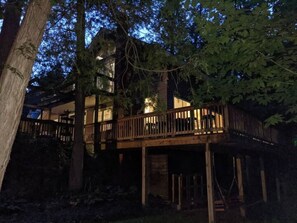 View of the Retreat at night from the shared fire pit area