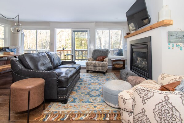 Great room with deck beyond