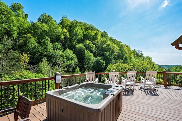 The cabin is surrounded by wooded hills. It truly adds to the relaxing solitude offered by this mountain retreat