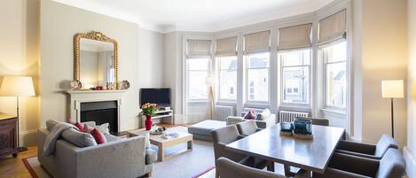 A spacious living room with sleek furnishings and décor