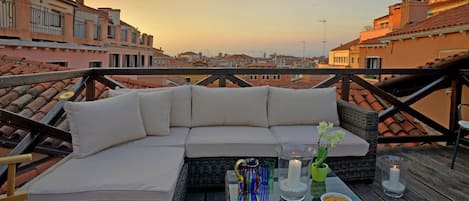 Toast the sunset from your private terrace that overlooks Venetian rooftops and cupolas.