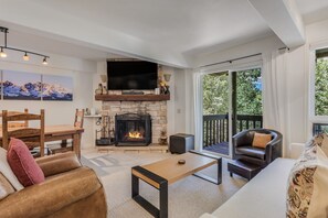Living room with wood-burning fireplace