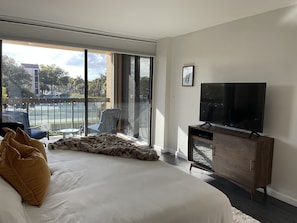 Master Bedroom w/ Smart TV, Electric Fireplace, black out curtains & balcony