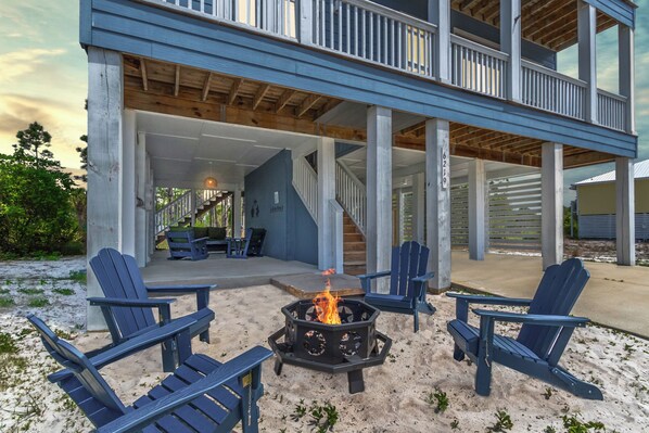 Relax by the firepit with your toes in the sand at the end of your beach day