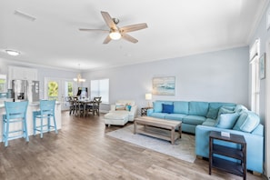 Open-concept living room offers comfortable and ample seating for your group