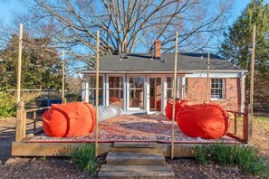 Lounge in these ginormous bean bag chairs with your friends and family underneath the stars on a warm summer night. The string lights add a warm glow to the atmosphere. 