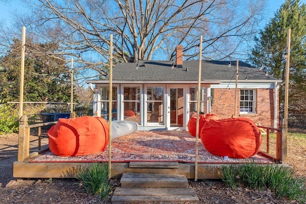Lounge in these ginormous bean bag chairs with your friends and family underneath the stars on a warm summer night. The string lights add a warm glow to the atmosphere.