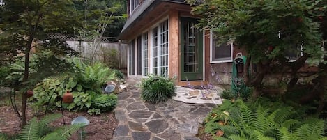 Take the meandering stone pathway to the door of the Raleigh Mill House