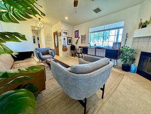 View of Living Room with Fireplace, record player, and comfy couch!