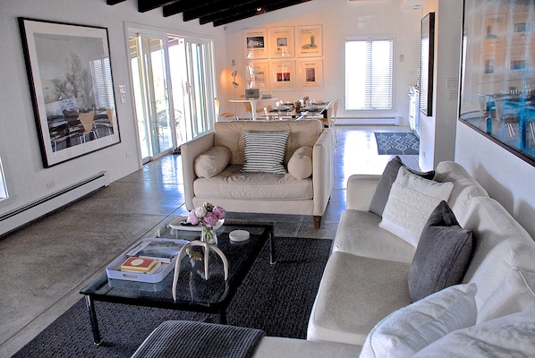 Open concept living, dining, kitchen and work area.
