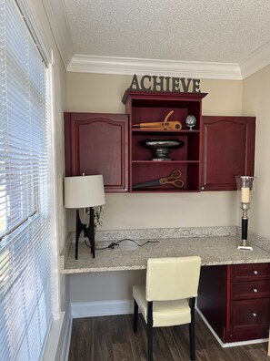 Sunroom with built-in desk area