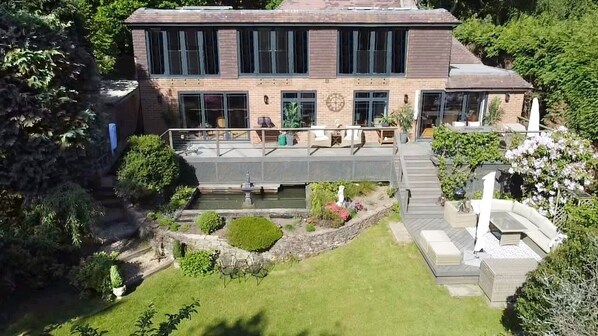 Rear of house overlooking 1/2 acre of mature gardens on 4 levels
