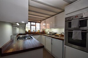 Fully equipped galley style kitchen