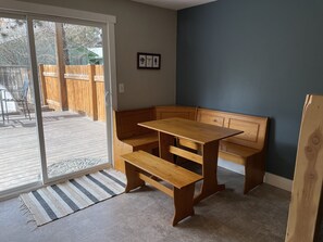 Kitchen nook with view of backyard deck