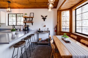 Kitchen and dining area to enjoy a home-cooked meal with friends or family.