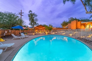 Large Pool with table, Chairs, umbrellas, and lounge chairs. fully fenced