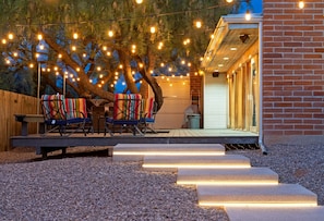 Lighted salk-up stairs to the large deck and seating area