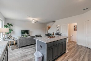 For your breakfasts, comfortably sit on the stools by the kitchen island