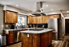 Fully stocked kitchen with stainless steel appliances