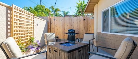 Outdoor patio with propane BBQ and seating for 6.Perfect for hanging out outside