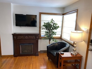 Enjoy the New 55 inch Roku Smart Flat Screen TV and Electric Fireplace.