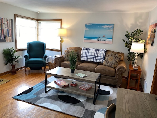 Nicely Furnished Living Room with new Simmons queen sleeper sofa.