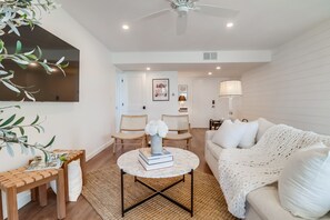Spacious living room with large seating area for movie night/cocktail hour