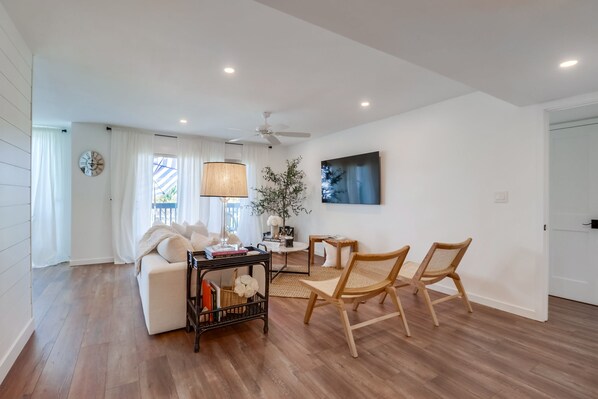 Spacious living room with large seating area for movie night/cocktail hour