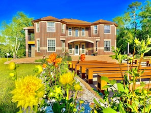Beautiful flower gardens make the yard bright all year around.