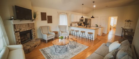 Stylish but cozy living space with lots of seating and modern farmhouse touches.